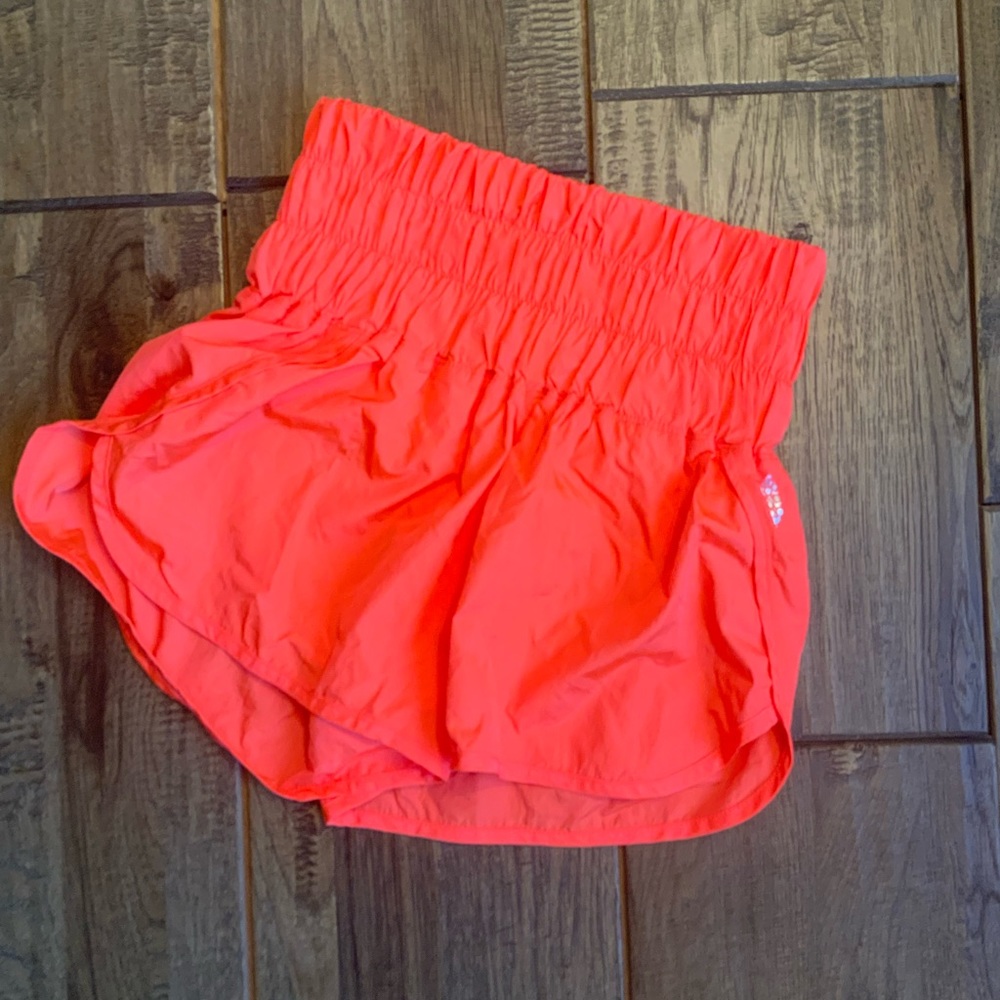 Free People Movement neon orange shorts. Size XS